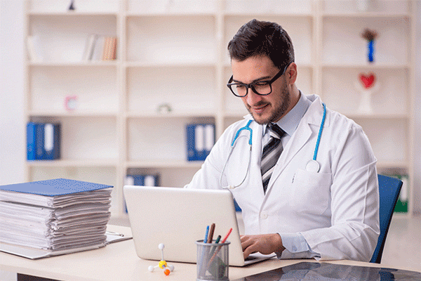 Doctor Eliminating Paperwork Through Digital Transformation