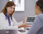Doctor Consulting Her Patient Using Technology
