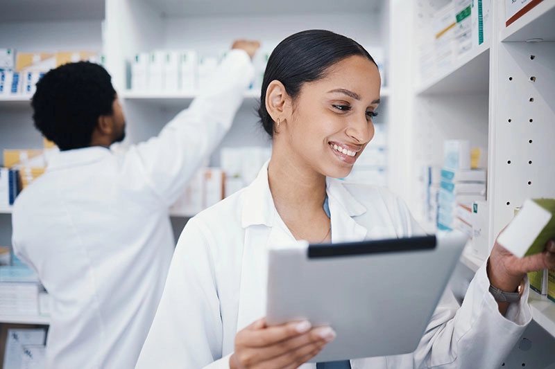 Hospital Pharmacy Staff Using Technology For Inventory
