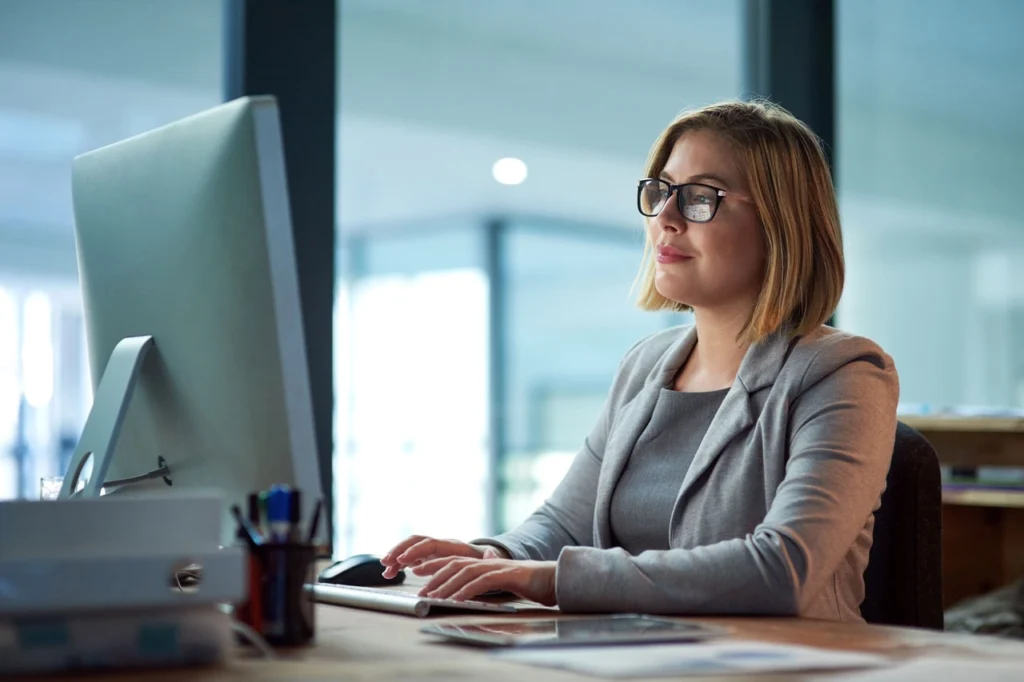 Innovate. Integrate. Elevate. Corporate Office Woman Computer 2x3 1024x682